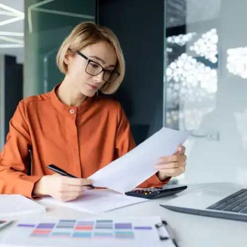 Businesswoman comparing energy business tariffs