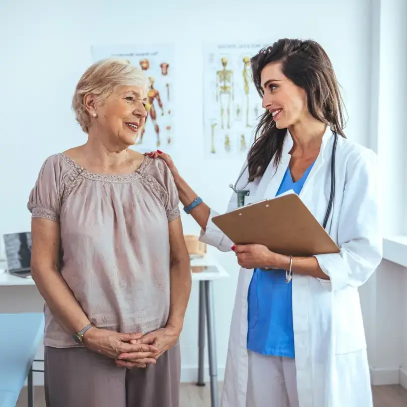 Female doctor in consultation with elderly female patient