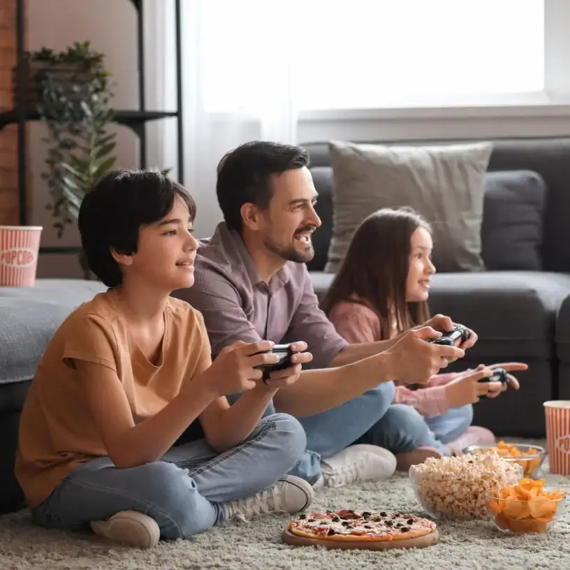 Family playing videogames on heated slab floors
